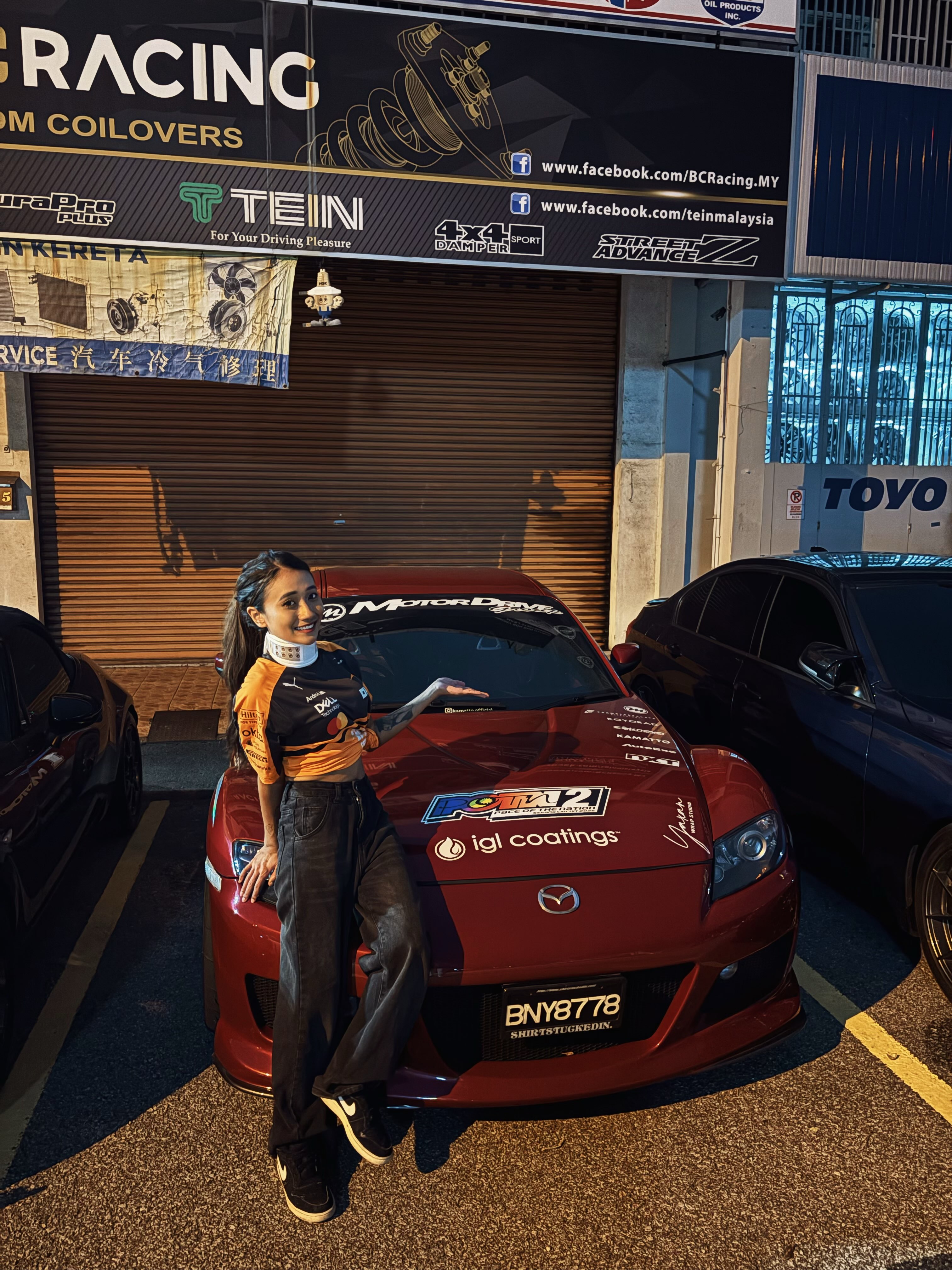 Fumiko Kriss and an MDG-branded red Mazda RX-7