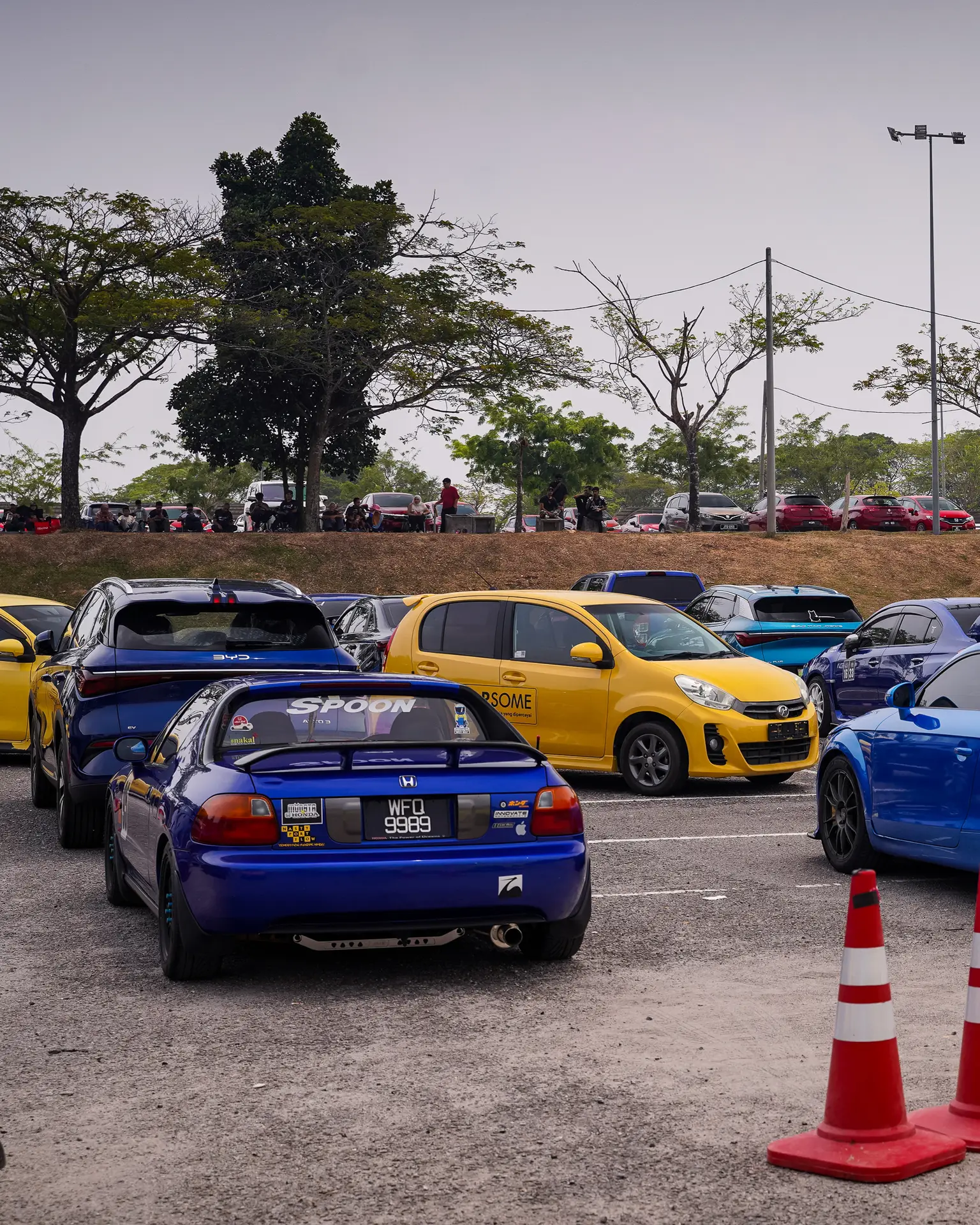 Blue Honda del Sol parked among blue and yellow cars at Jalur Gemilang Gathering 2026.
