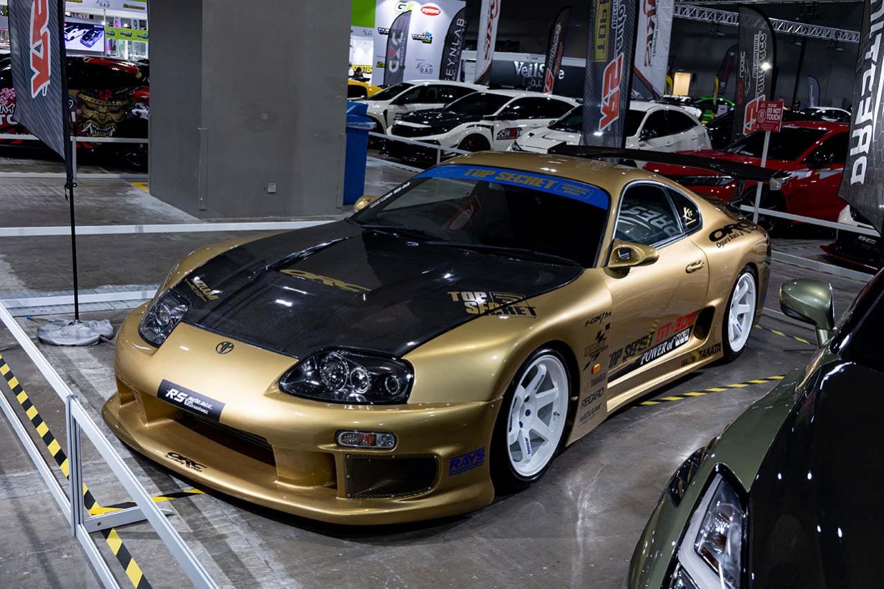 Gold widebody Toyota Supra displayed at Tokyo Auto Salon Kuala Lumpur 2024.